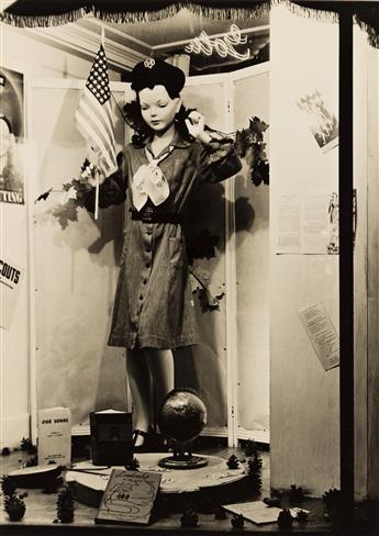 (WINDOW DISPLAYS) A group of 16 photographs of posed, fashionably dressed mannequins, some with seasonal decorations.